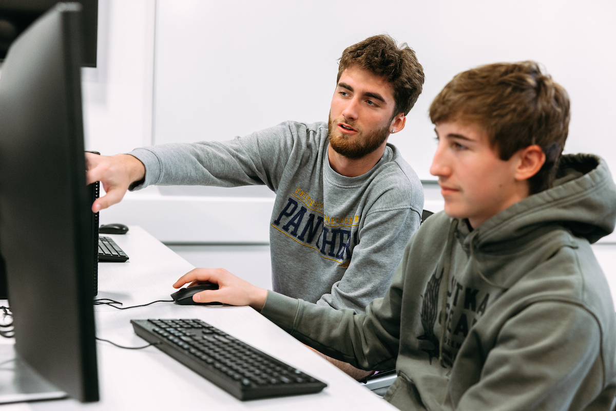 Two people at a computer