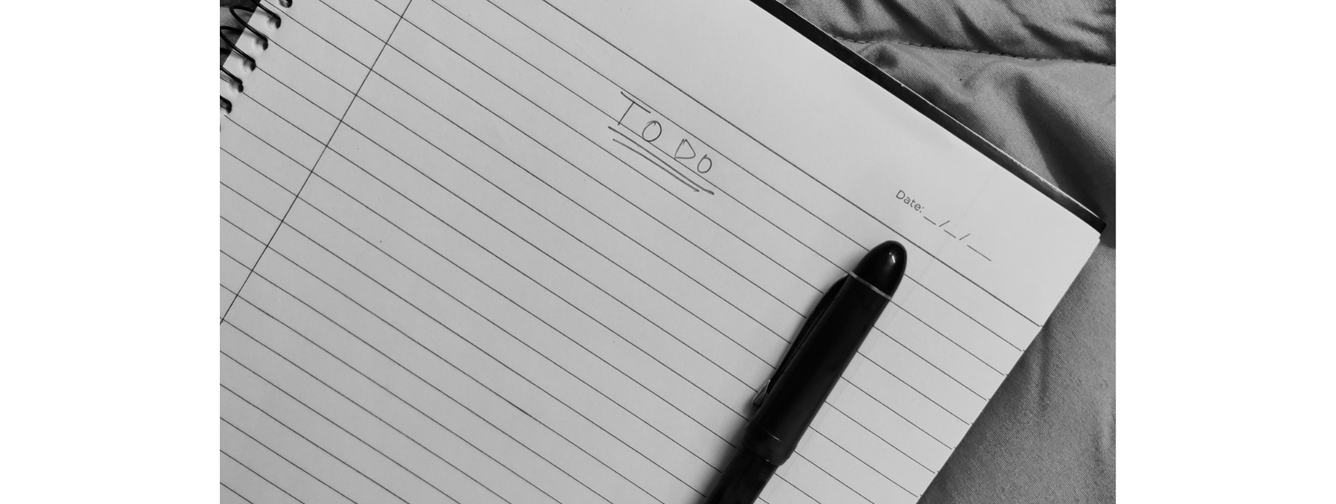 To Do list on paper with a pen